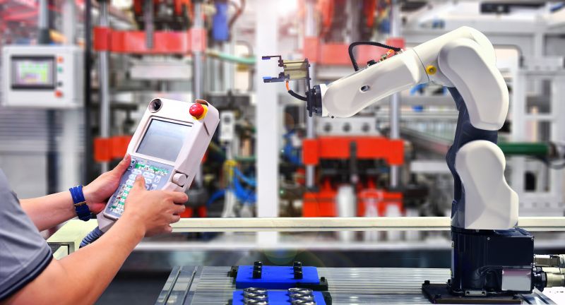 engineer-check-control-automation-robot-arm-machine-automotive-bearings-packing-process-factory